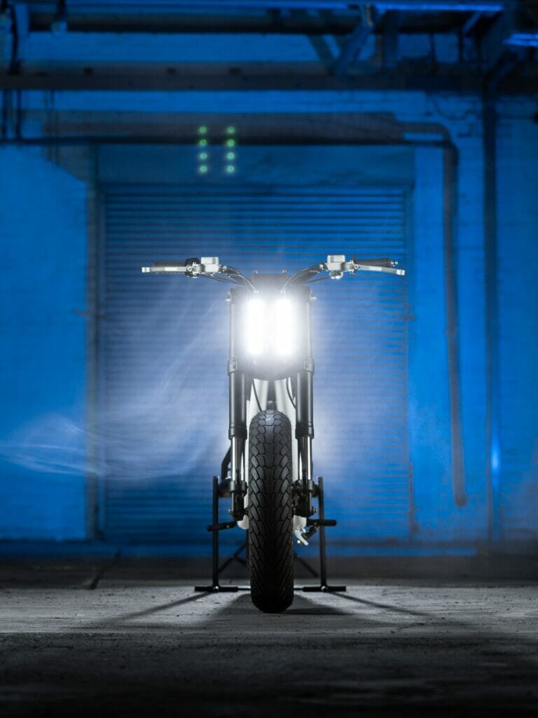Untitled's Electric Supermoto Vision parked in a dark garage.