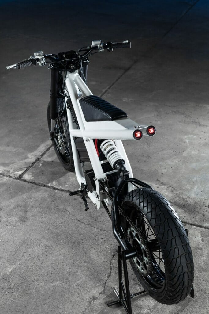 Untitled's Electric Supermoto Vision parked on a concrete floor.