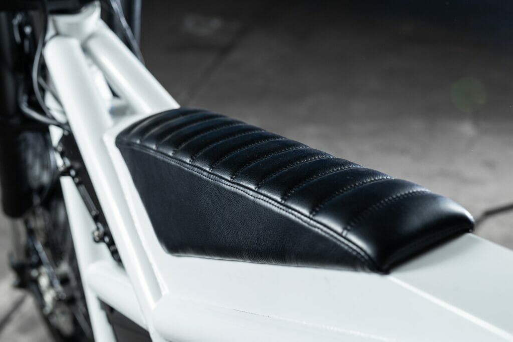 A close up of the seat of an Untitled's Electric Supermoto Vision bike.