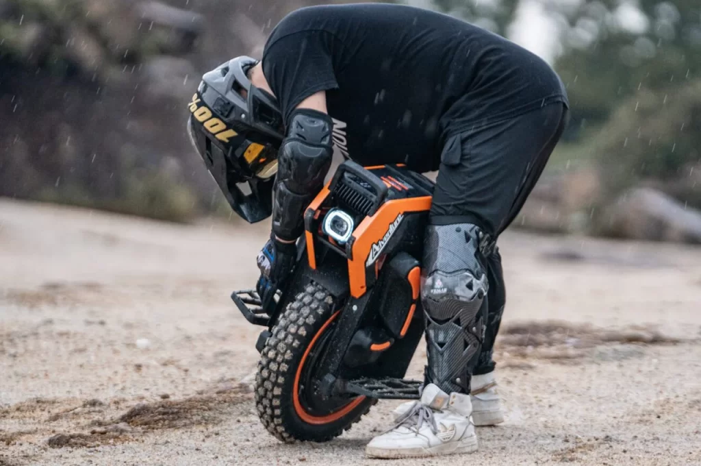 A man is maneuvering on a dirt bike in an Auto Draft position.