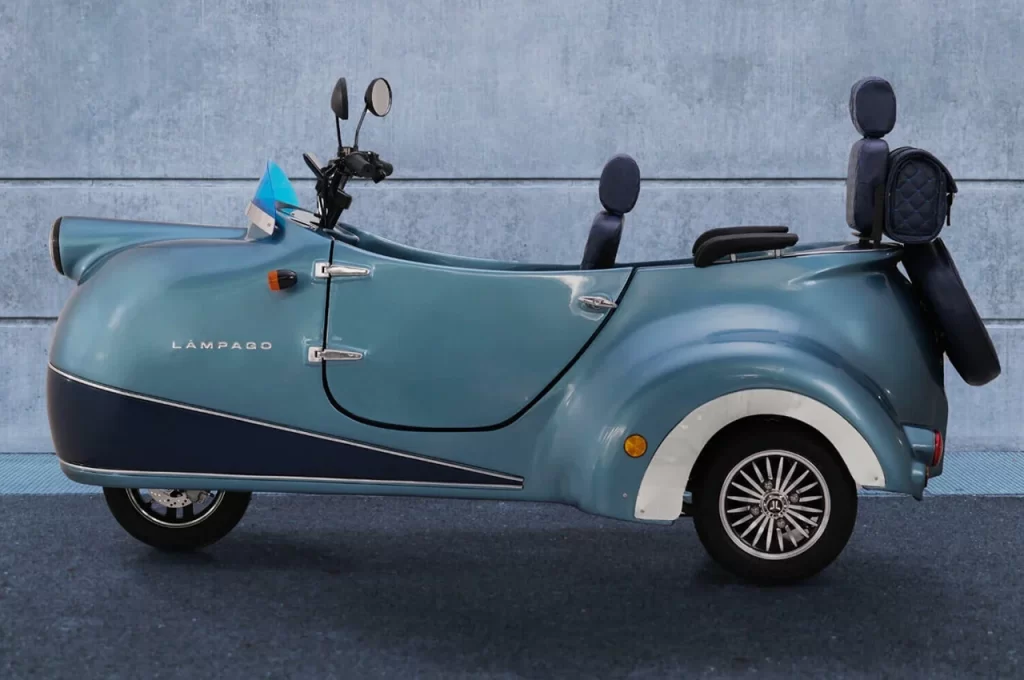 Blue tricycle, concrete wall.