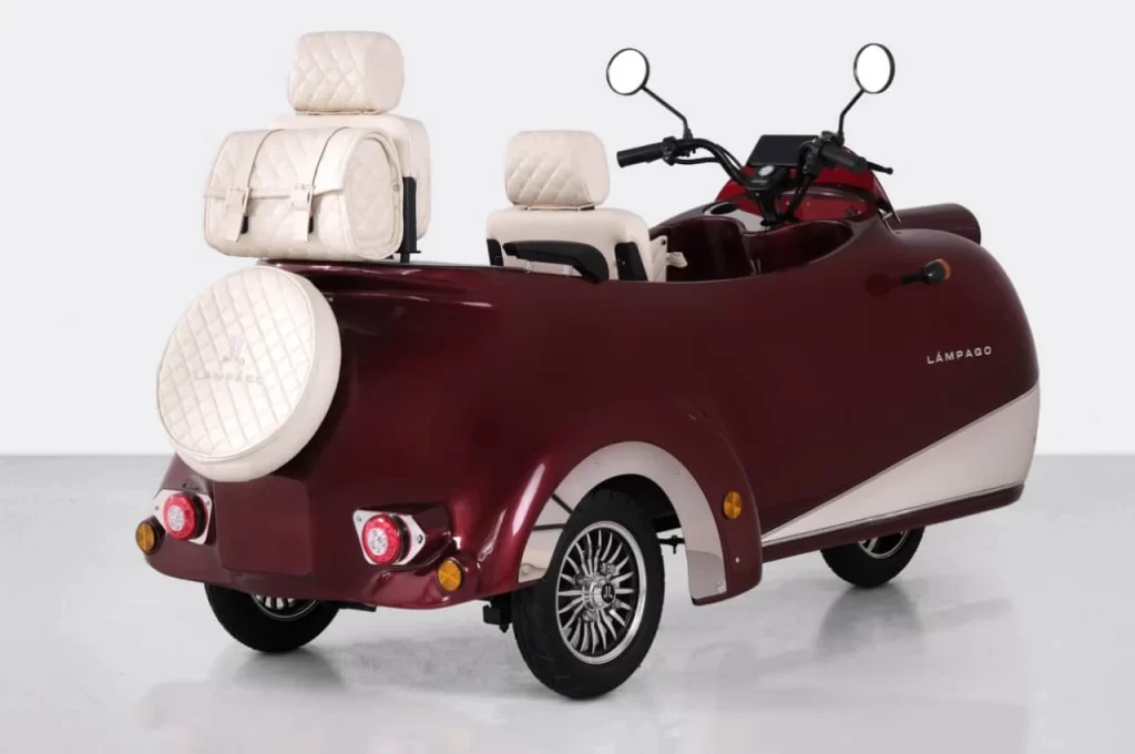 Maroon tricycle with two seats and back seat.