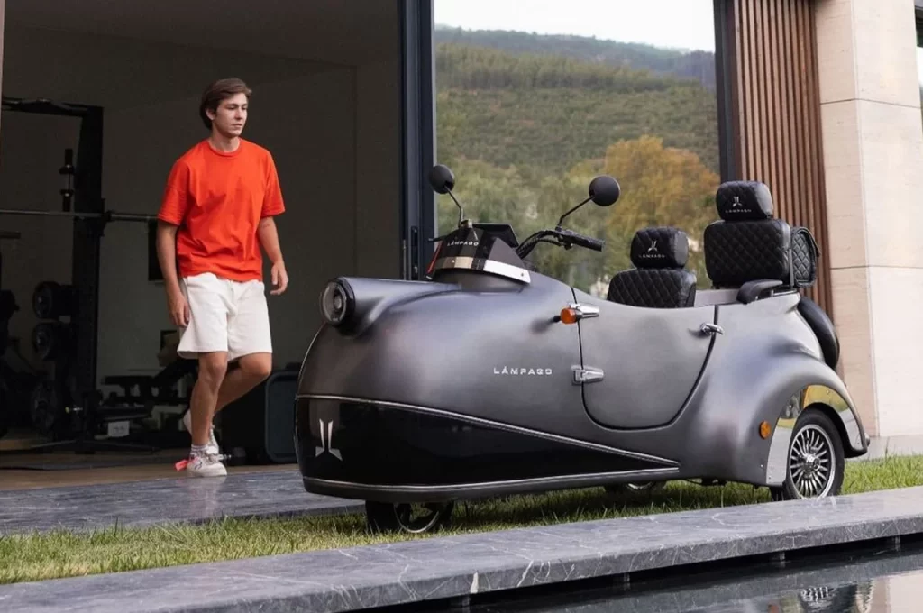 Man, house, motorized vehicle.