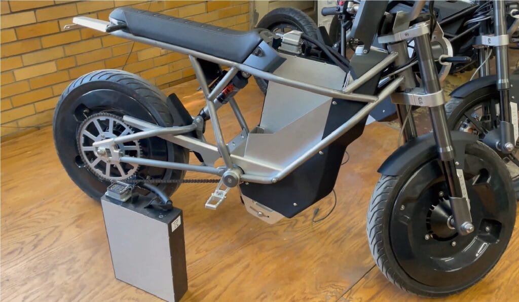 An electric bike sitting on a wooden floor, Secures $7 Million for US Production.