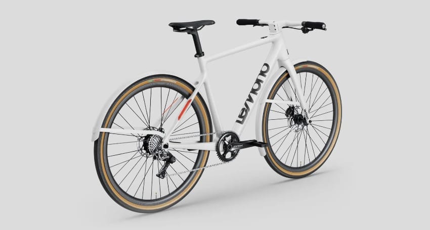 LeMond Prolog White bicycle with drop handlebars, black saddle, wide tires, and a rear fender. The bike features the brand name "Levoro" written on the frame. As one of the lightest electric bikes available, it combines sleek design with advanced technology.
