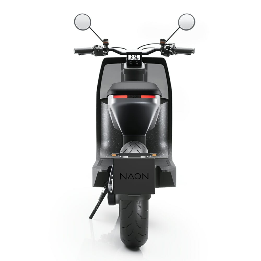 A black scooter is shown on a white background.