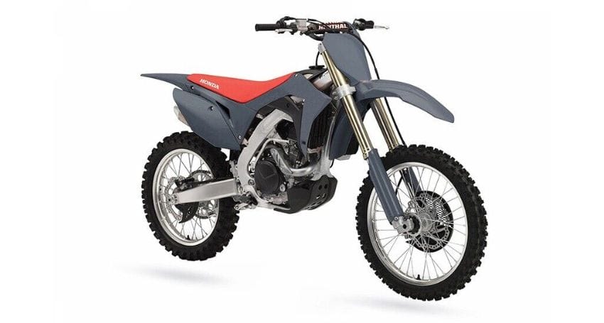A gray and red dirt bike on a white background.