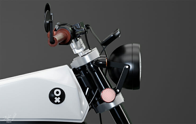 A close up of a white motorcycle with a red handlebar.
