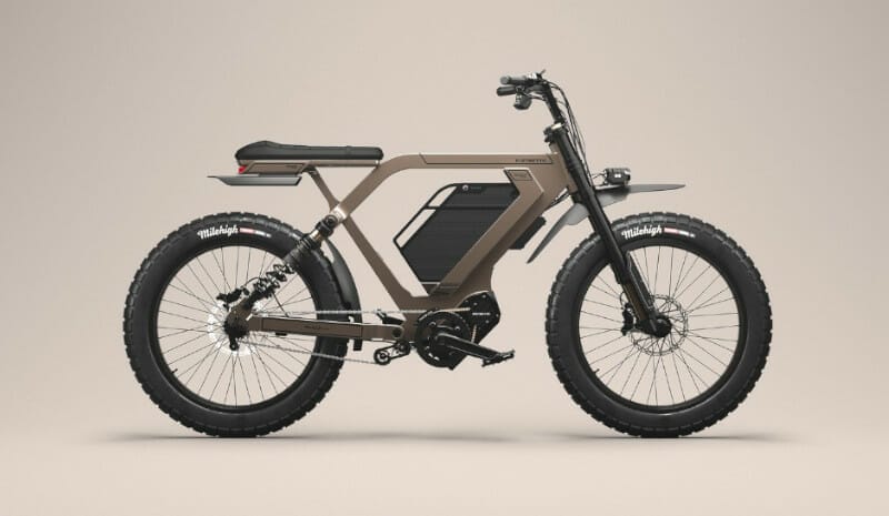An electric bike is shown on a gray background.