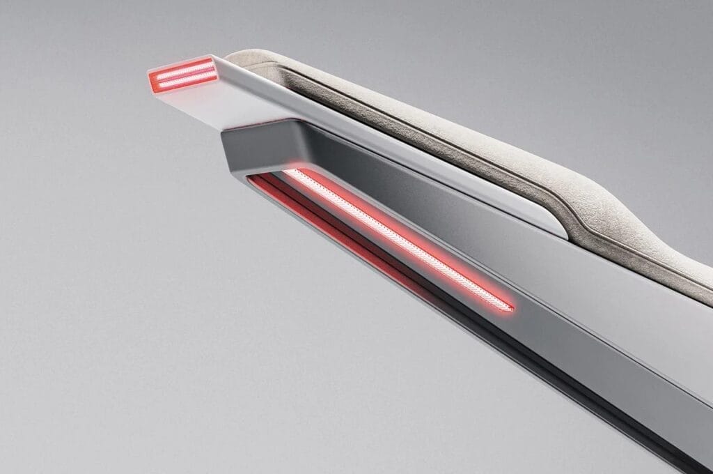 A close up of a red light on an Electric Café Racer Superbike seat.