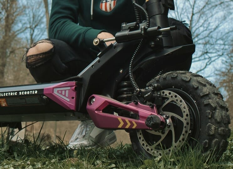 a person sitting on a motorcycle in a field