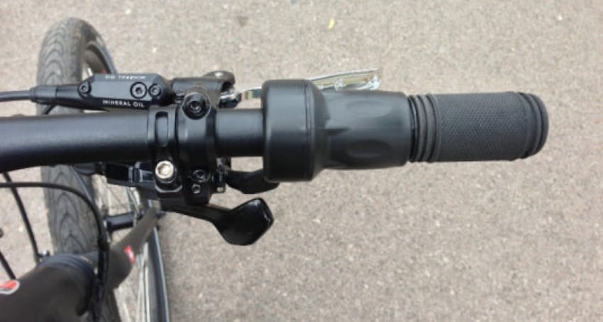 A close up of the handlebar on an ebike.