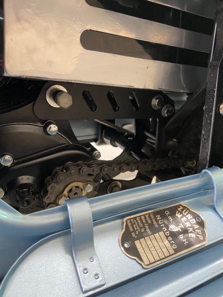 Electrifies 1958 Zundapp Bella 154 by Moto Design Garage with a blue motorcycle.