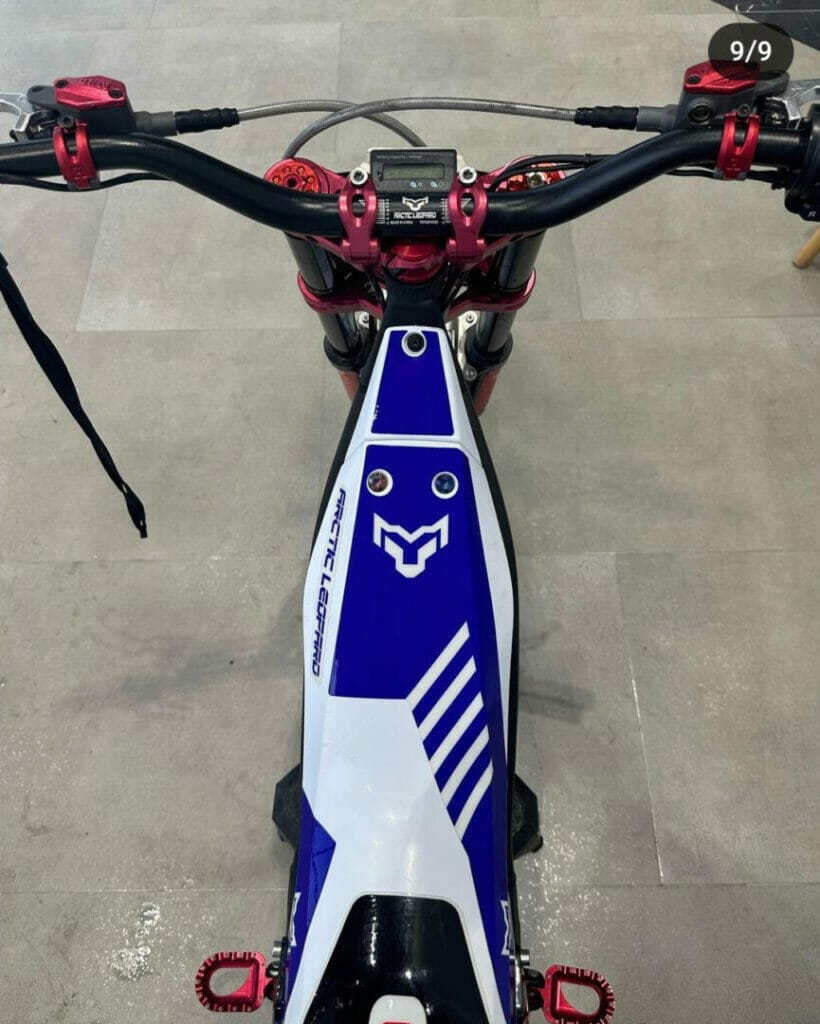 A dirt bike in a showroom.