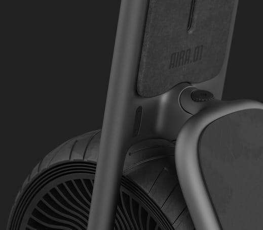 A close up of a black scooter with a great design and a fan on it.