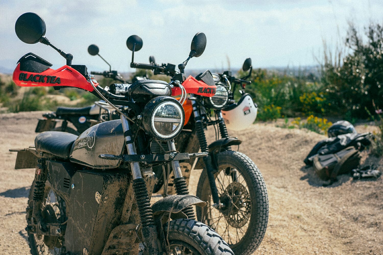 a motorcycle parked on a dirt road