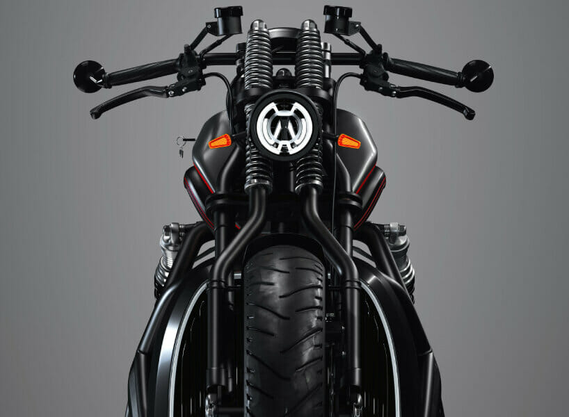 The front end of a motorcycle is shown against a gray background.