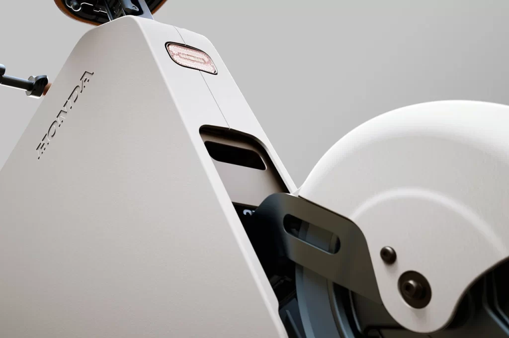 A close up of a white electric scooter.