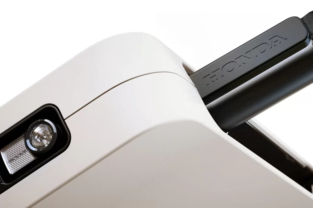 A close up of a device with a camera attached to it, featuring Kawasaki's <a href=