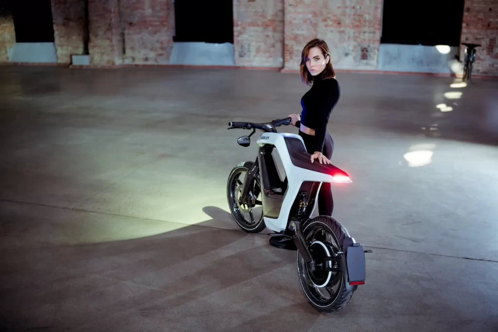 A woman standing next to an <a href=