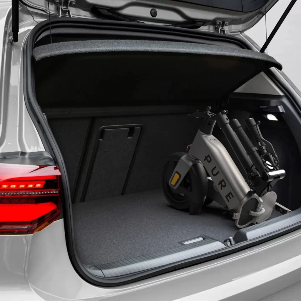 The trunk of an audi a3 with a bike in it.