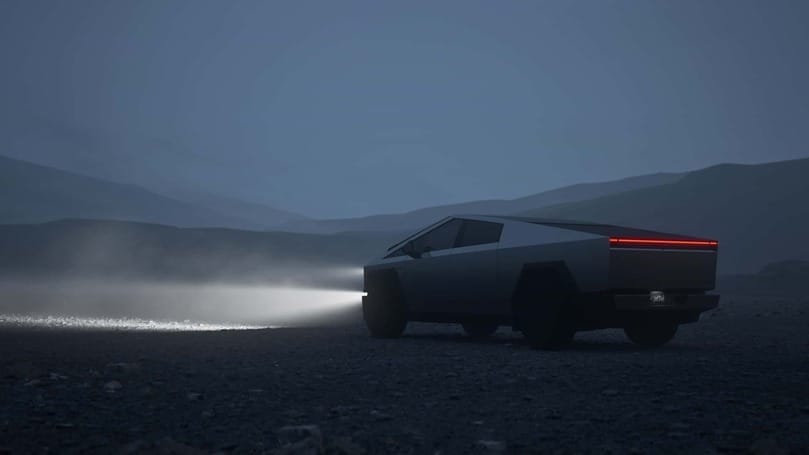 The Cybertruck, a futuristic vehicle developed by Tesla and Elon Musk, is driving through the desolate desert landscape under the starry night sky.
