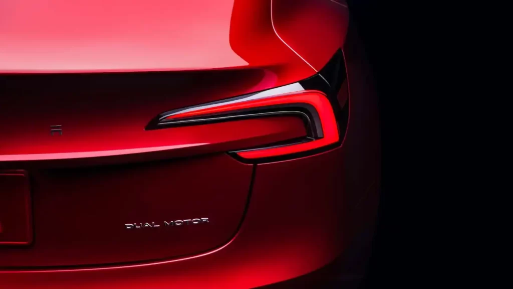 The redesigned rear end of a red Tesla Model X.