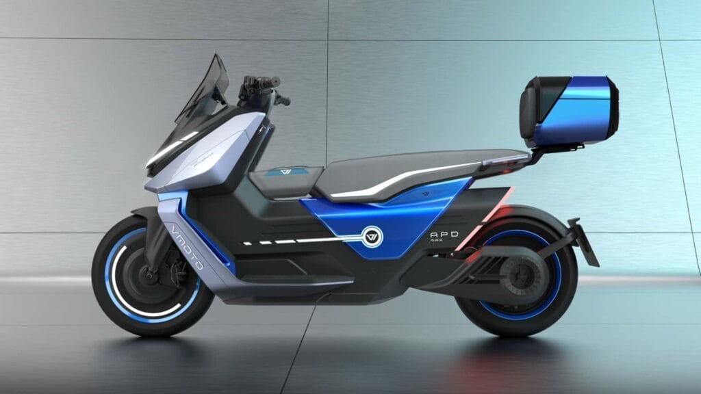 A blue and black electric scooter is parked in a room.