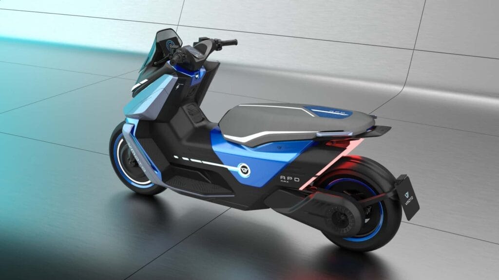 A blue and black electric scooter is parked in a room.