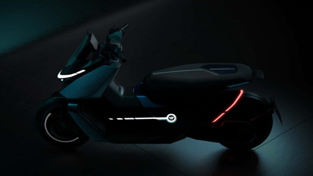 A scooter is shown in a dark room.