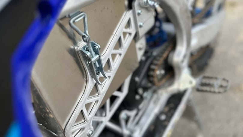 A close up of a motorcycle with a chain on it.