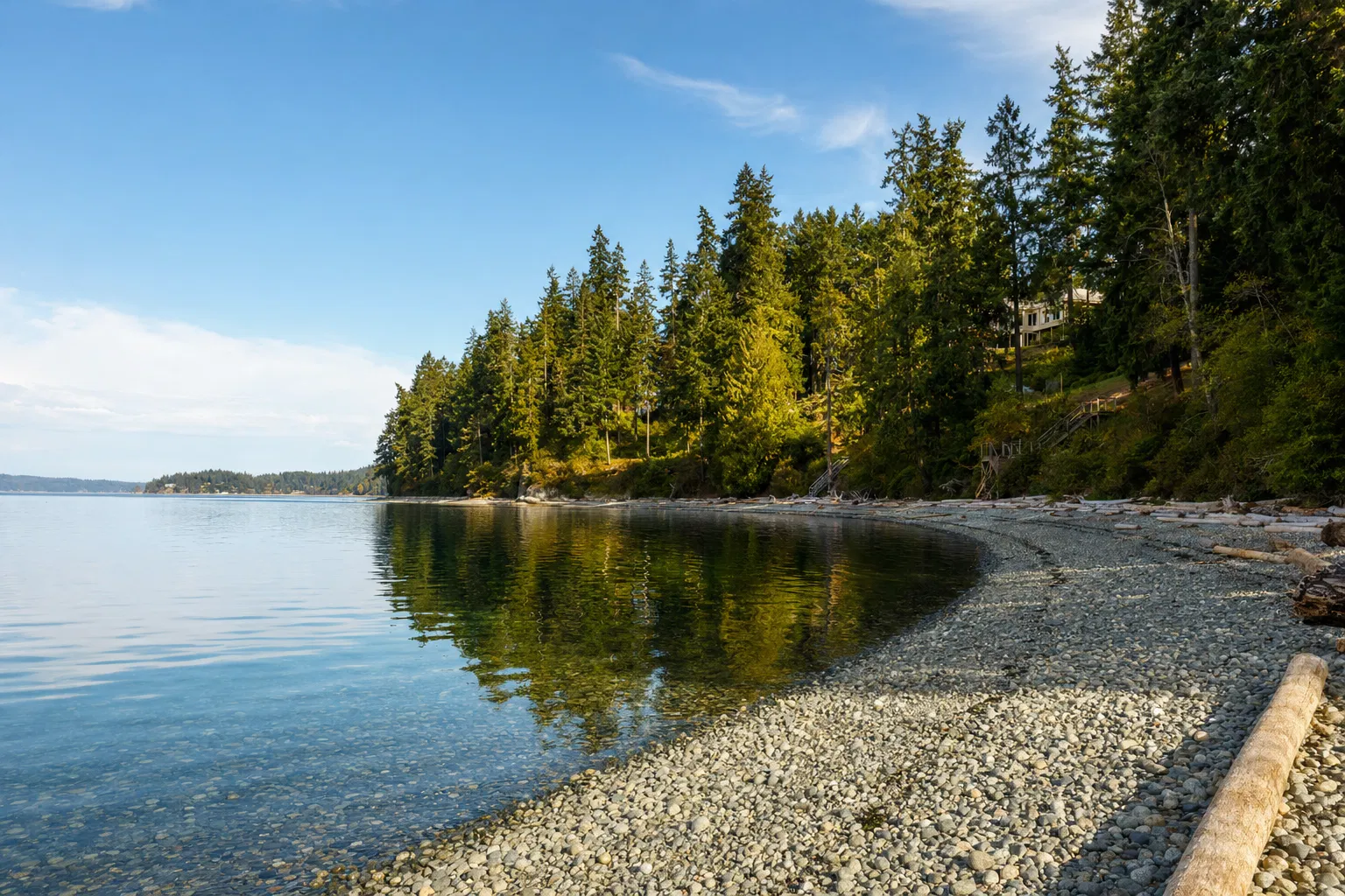 Private beach access on Totten Inlet with pebble shore and evergreen forest
