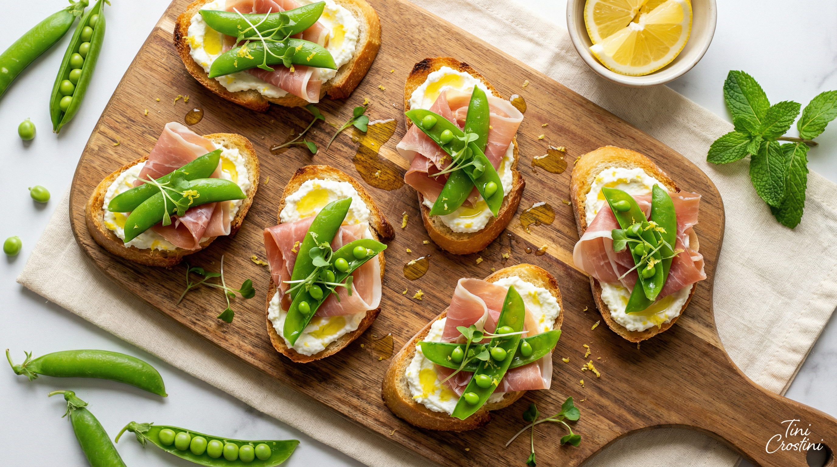 Spring Pea and Prosciutto Crostini with Lemon-Mint Ricotta