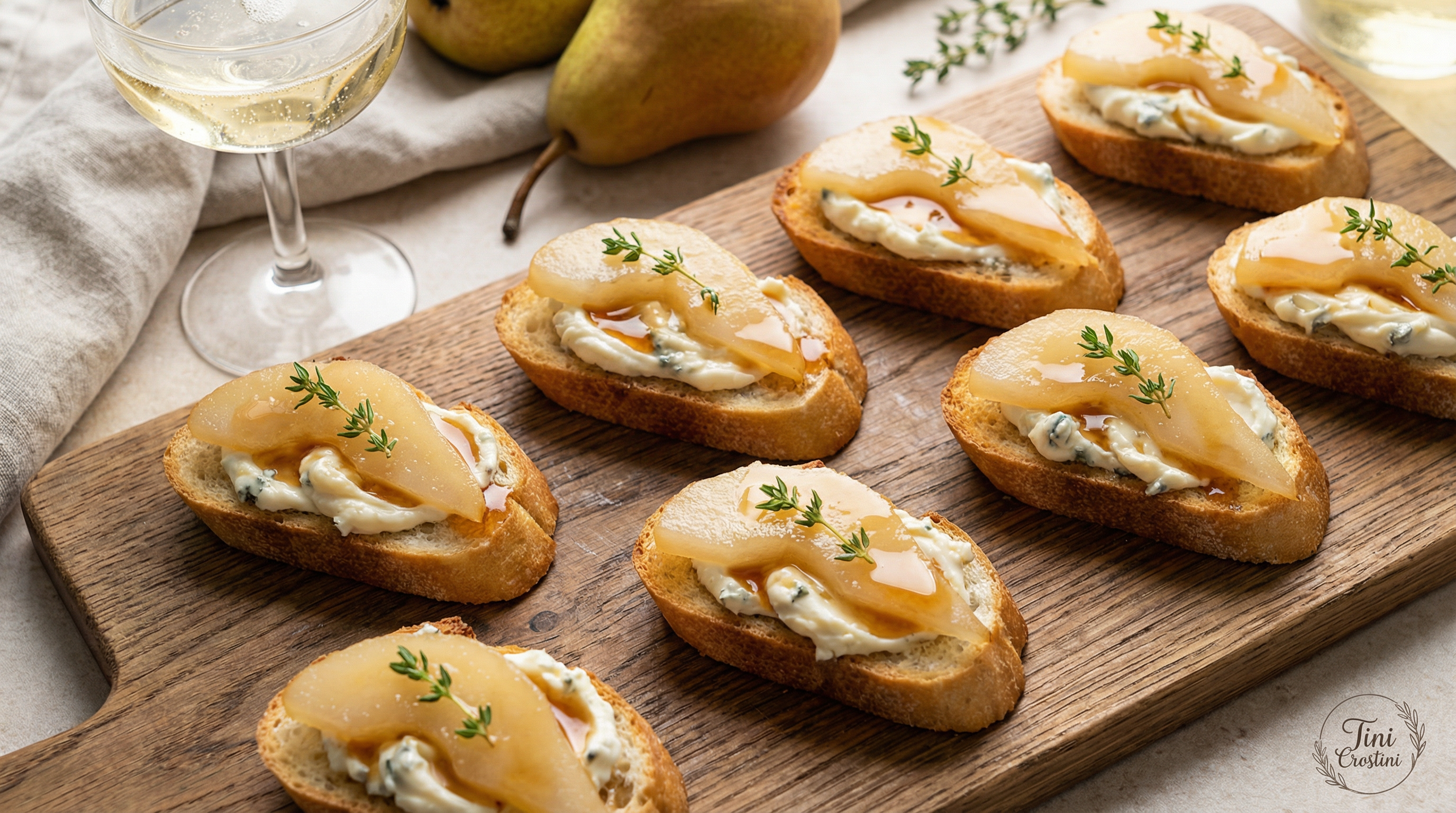 Prosecco-Poached Pear and Gorgonzola Crostini