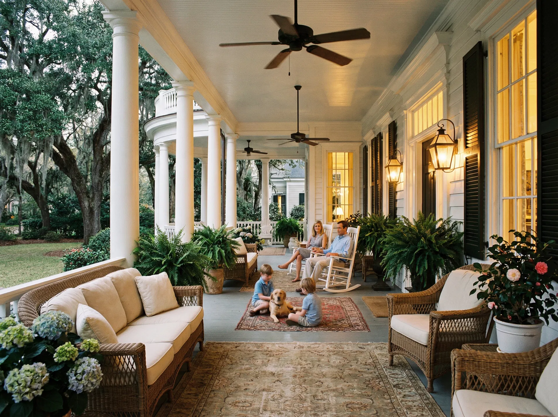 Elegant covered porch with family enjoying the evening
