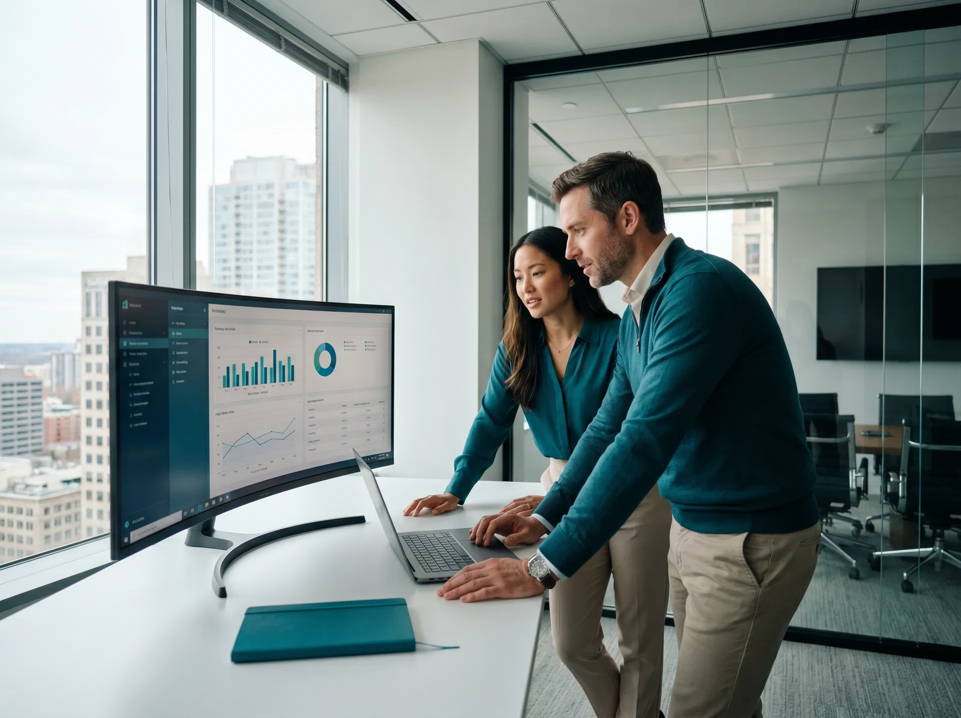 B2B professionals reviewing marketing analytics dashboard in modern office