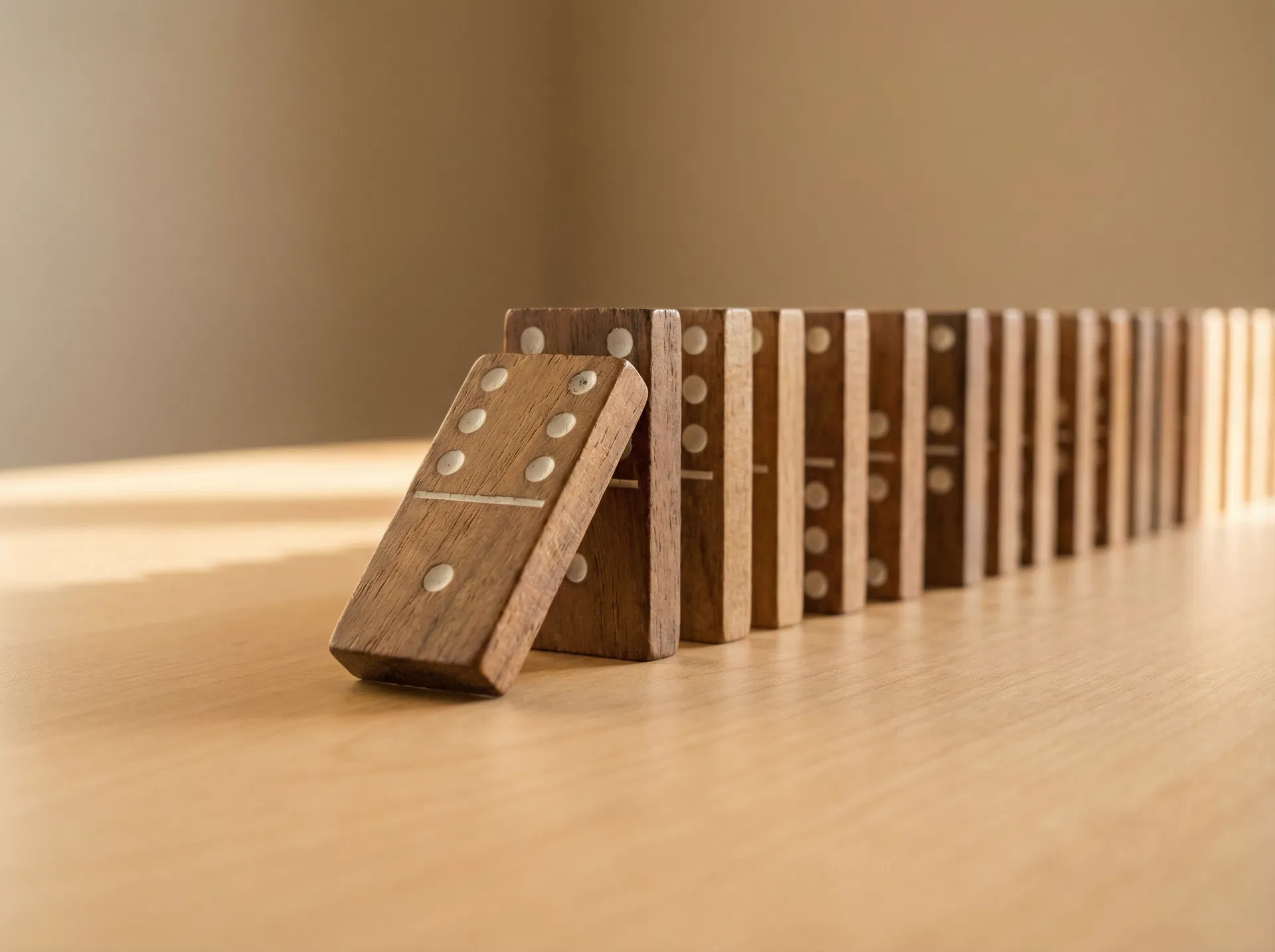 First domino tipping — the keystone correction