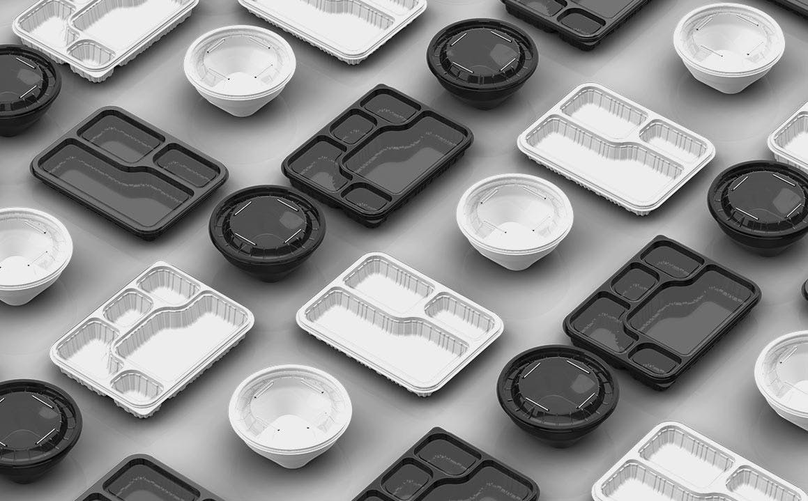 A collection of thermoformed PP disposable plates and bowls in various sizes and designs, suitable for food service and takeout.