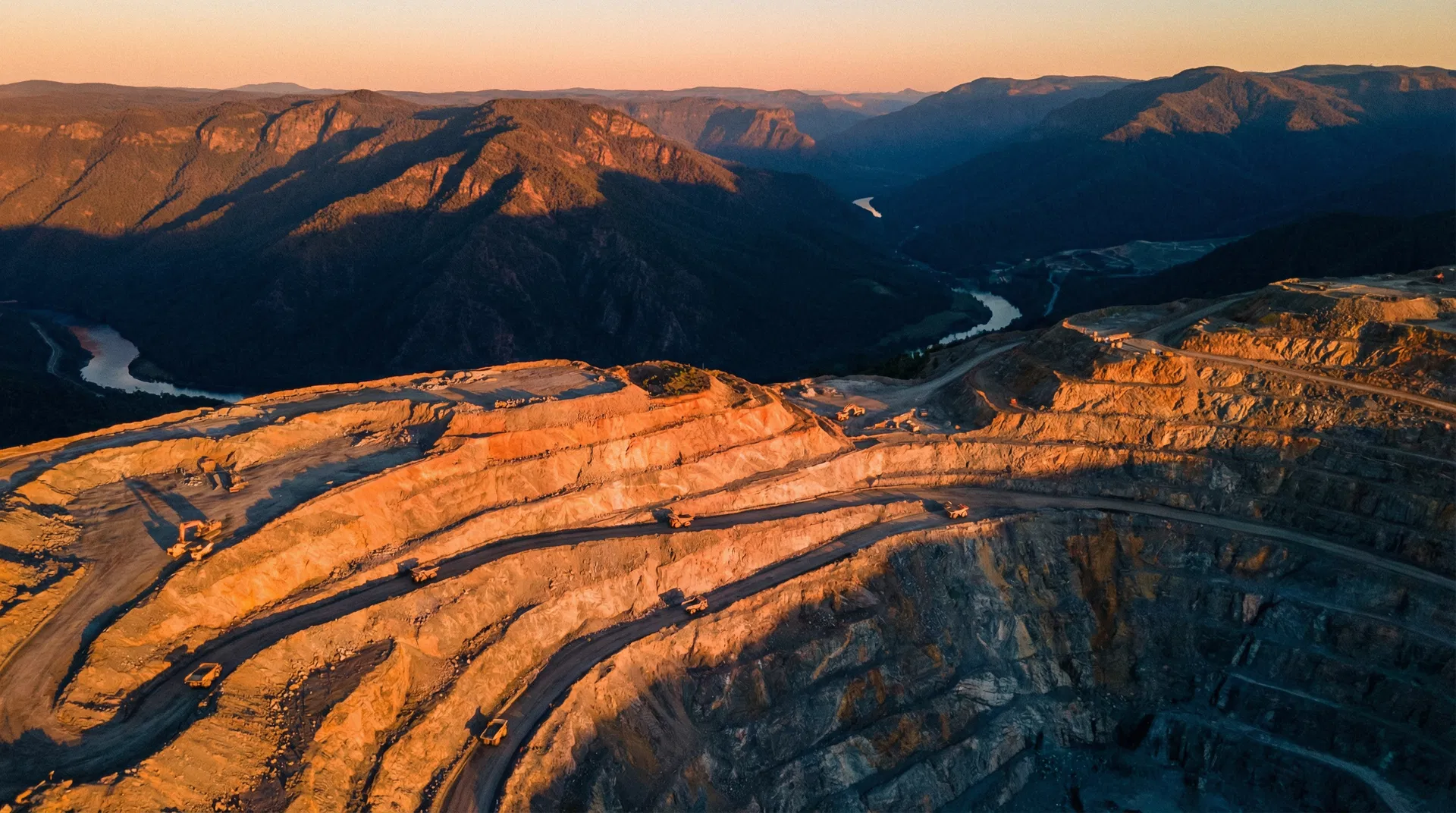 Open-pit mining operations at golden hour