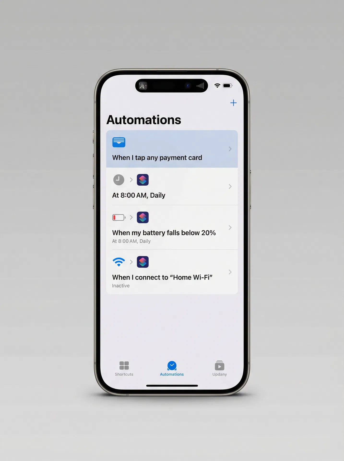 iPhone showing the Shortcuts app Automations tab