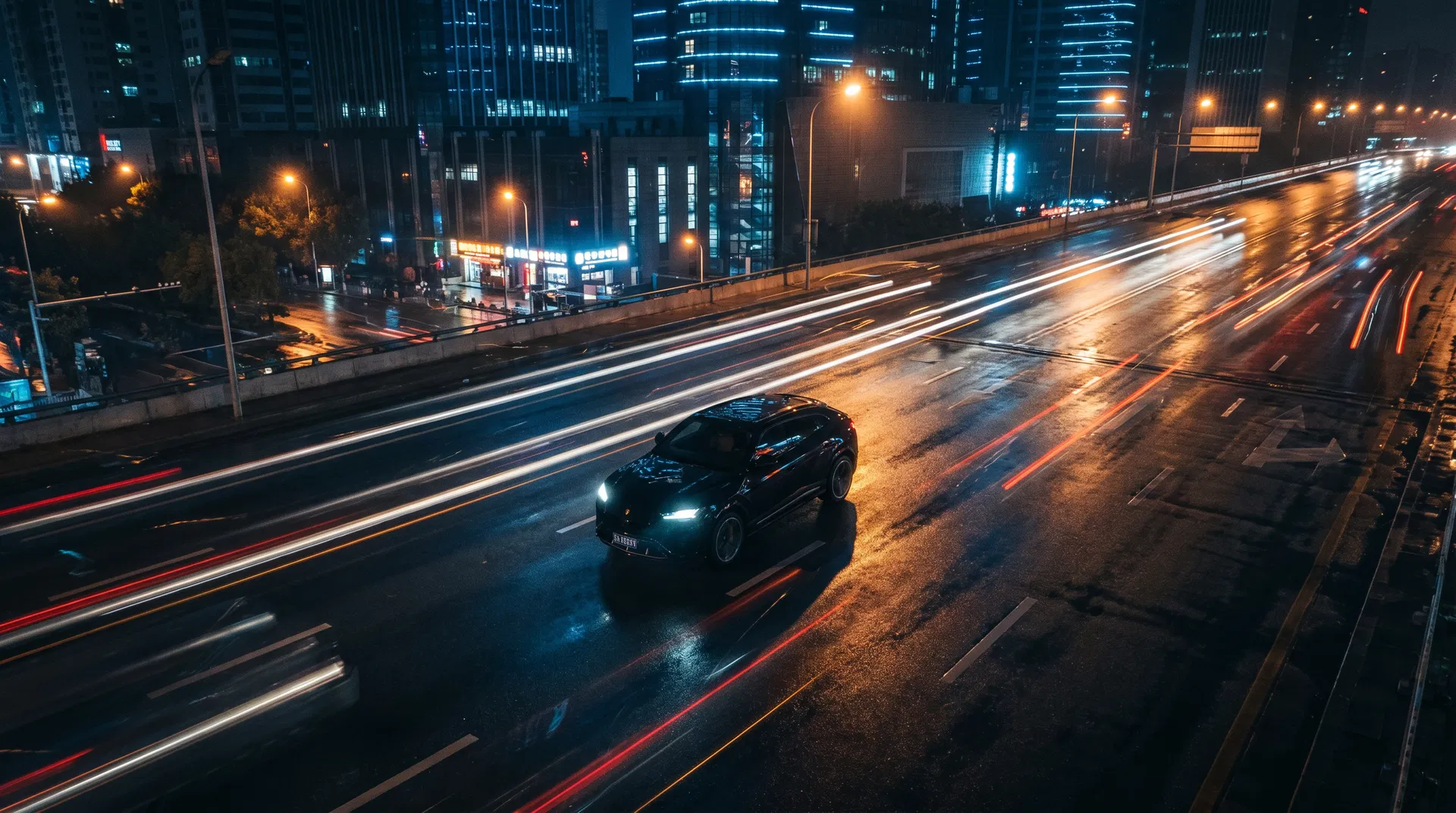 Luxury SUV driving through city at night