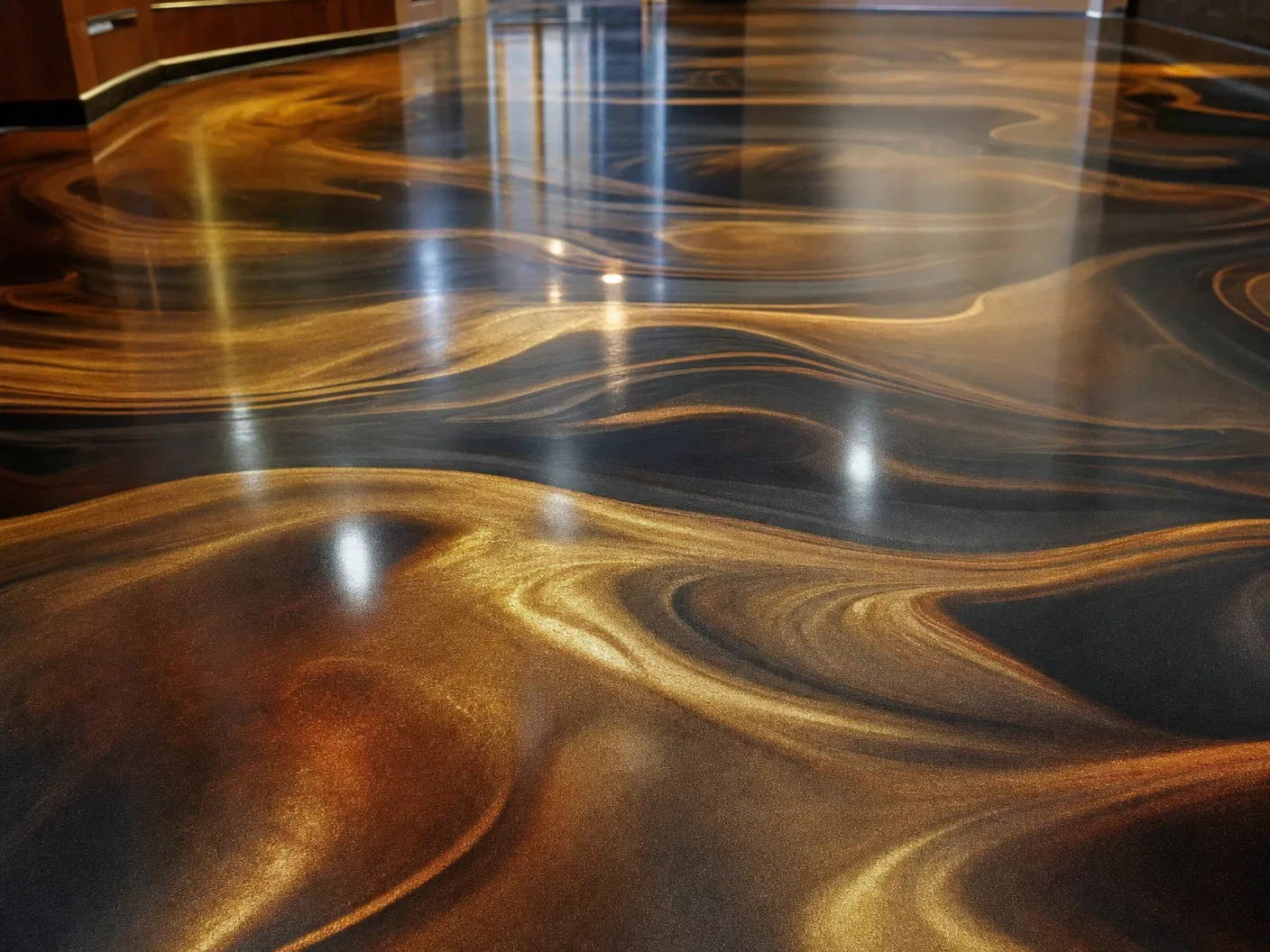 Metallic epoxy floor with gold and bronze swirling patterns, Baltimore MD
