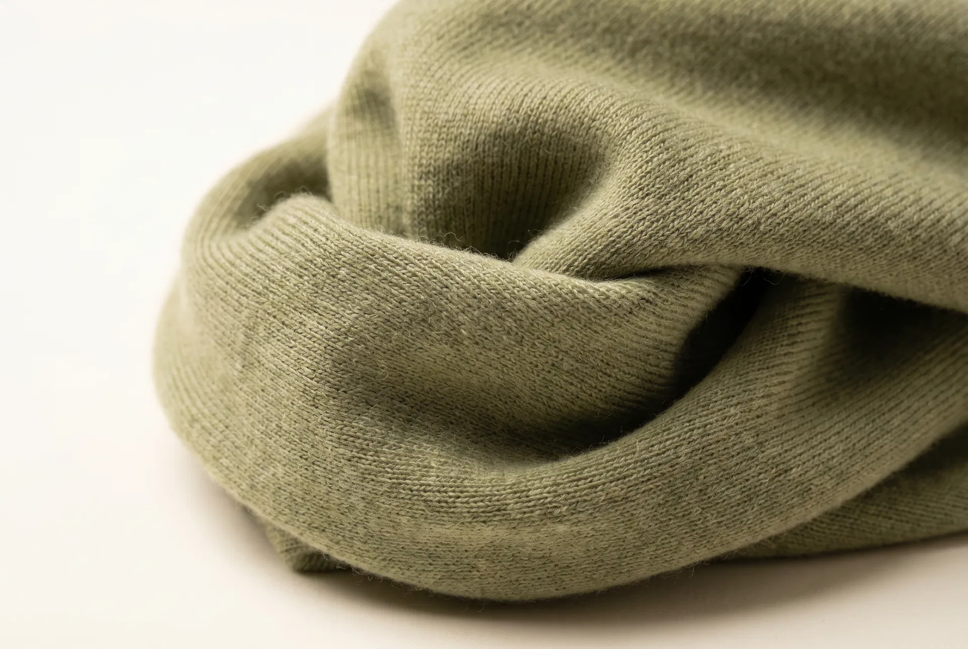 Premium merino wool fabric close-up texture — ultra-fine 18.5 micron fibers