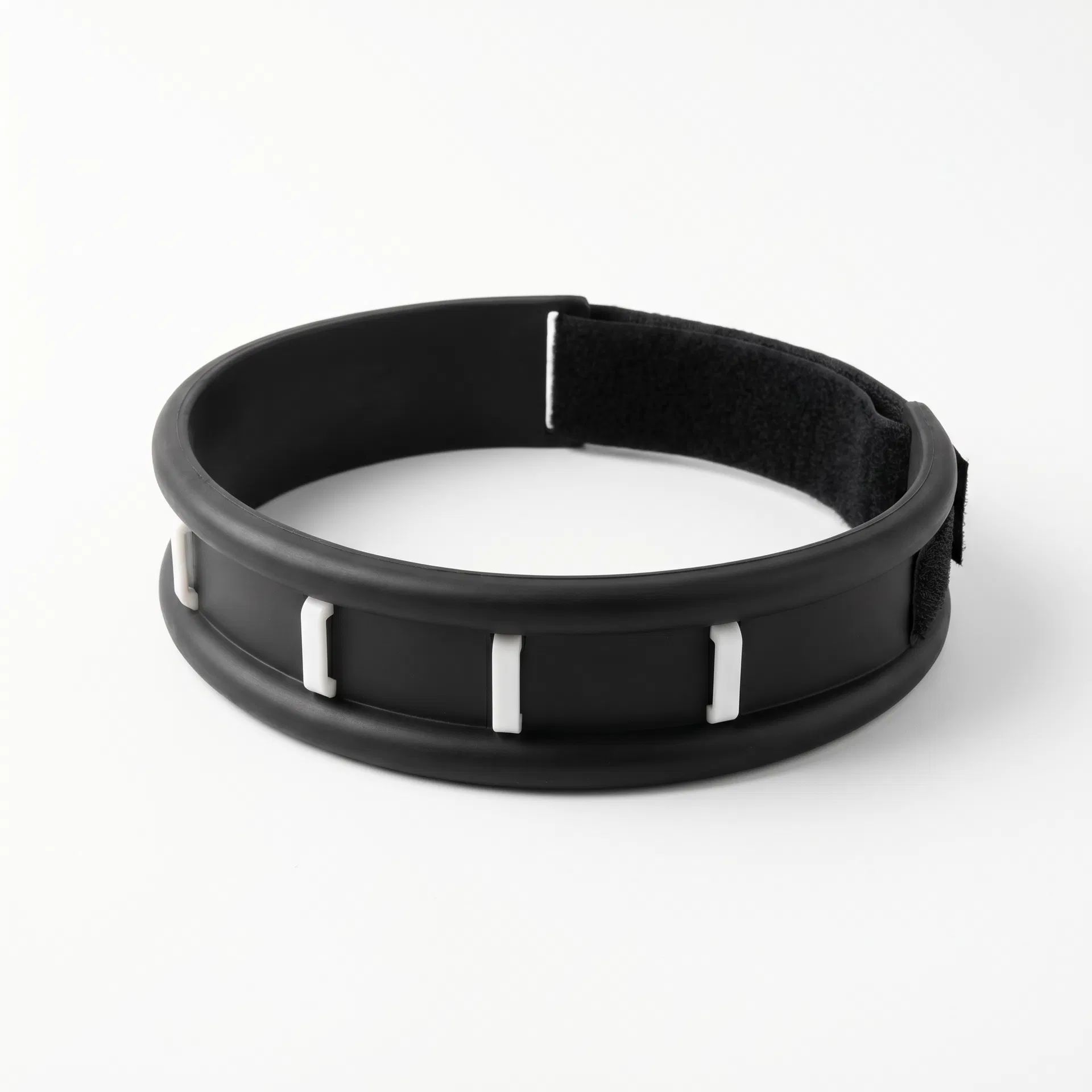 Optimal Neck Support Brace product photo — black flexible synthetic tubing collar with white interchangeable front support posts and velcro rear closure