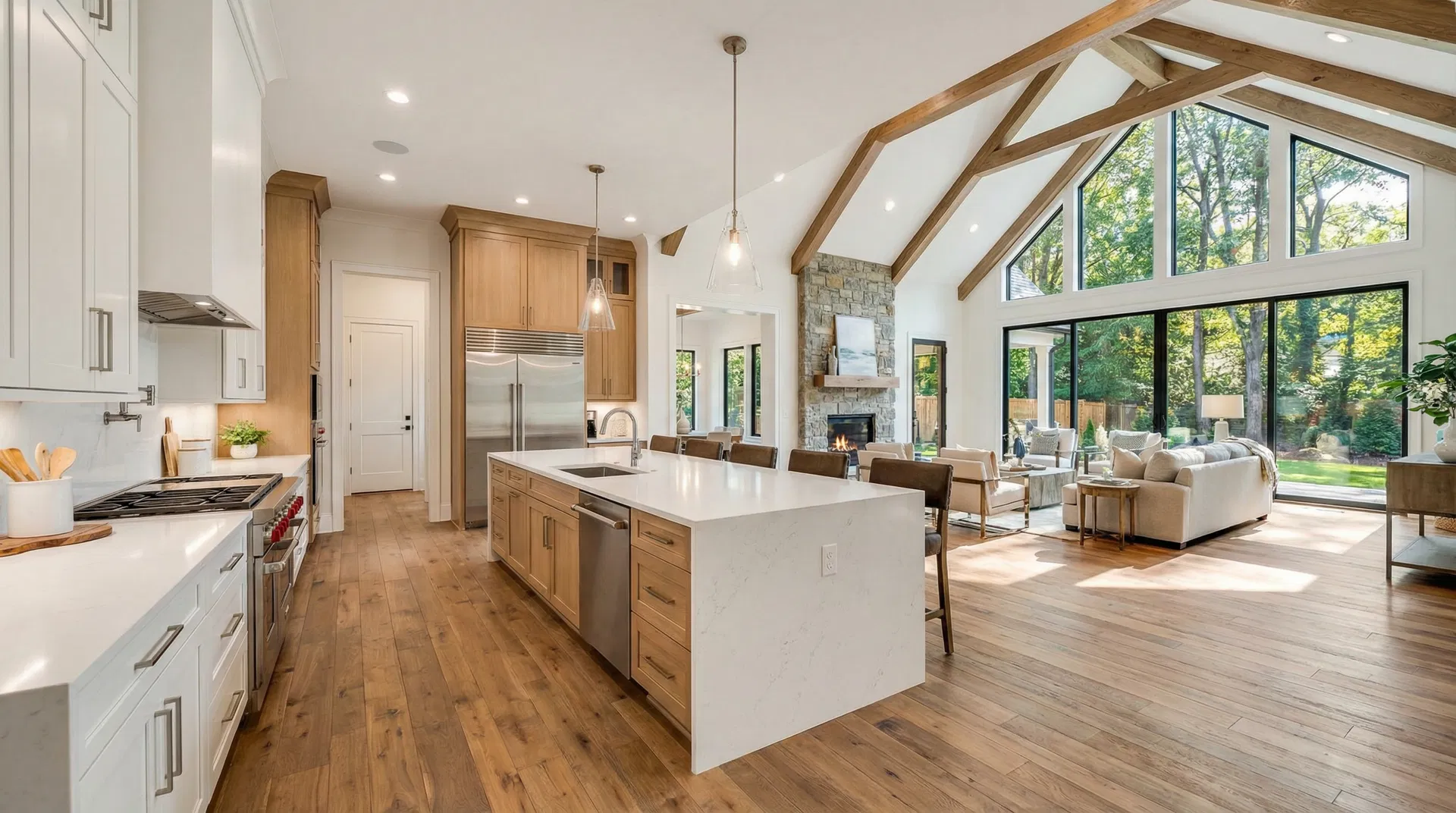 Bright open-concept kitchen and living room interior of luxury new construction home