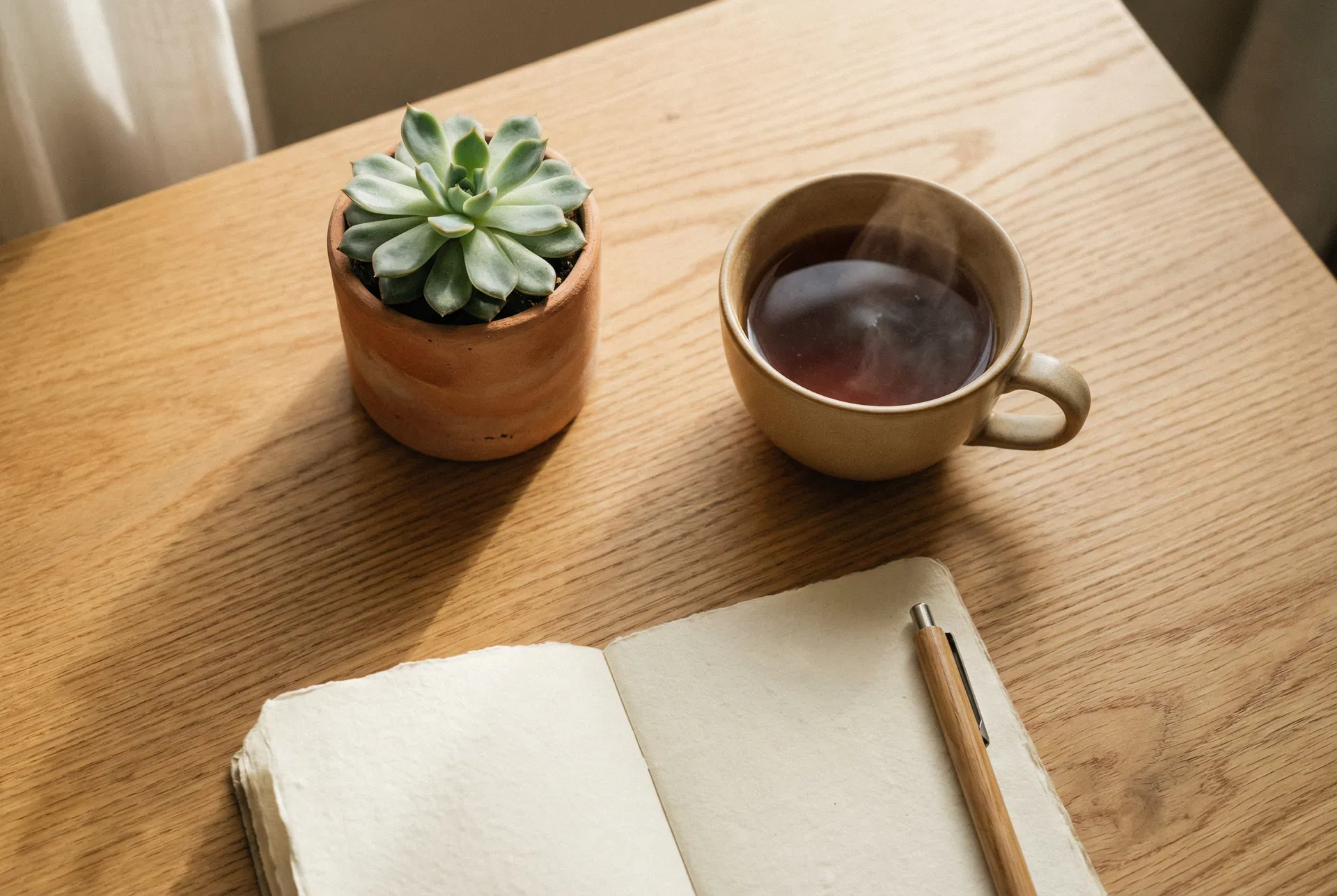 Mindful workspace with tea and notebook