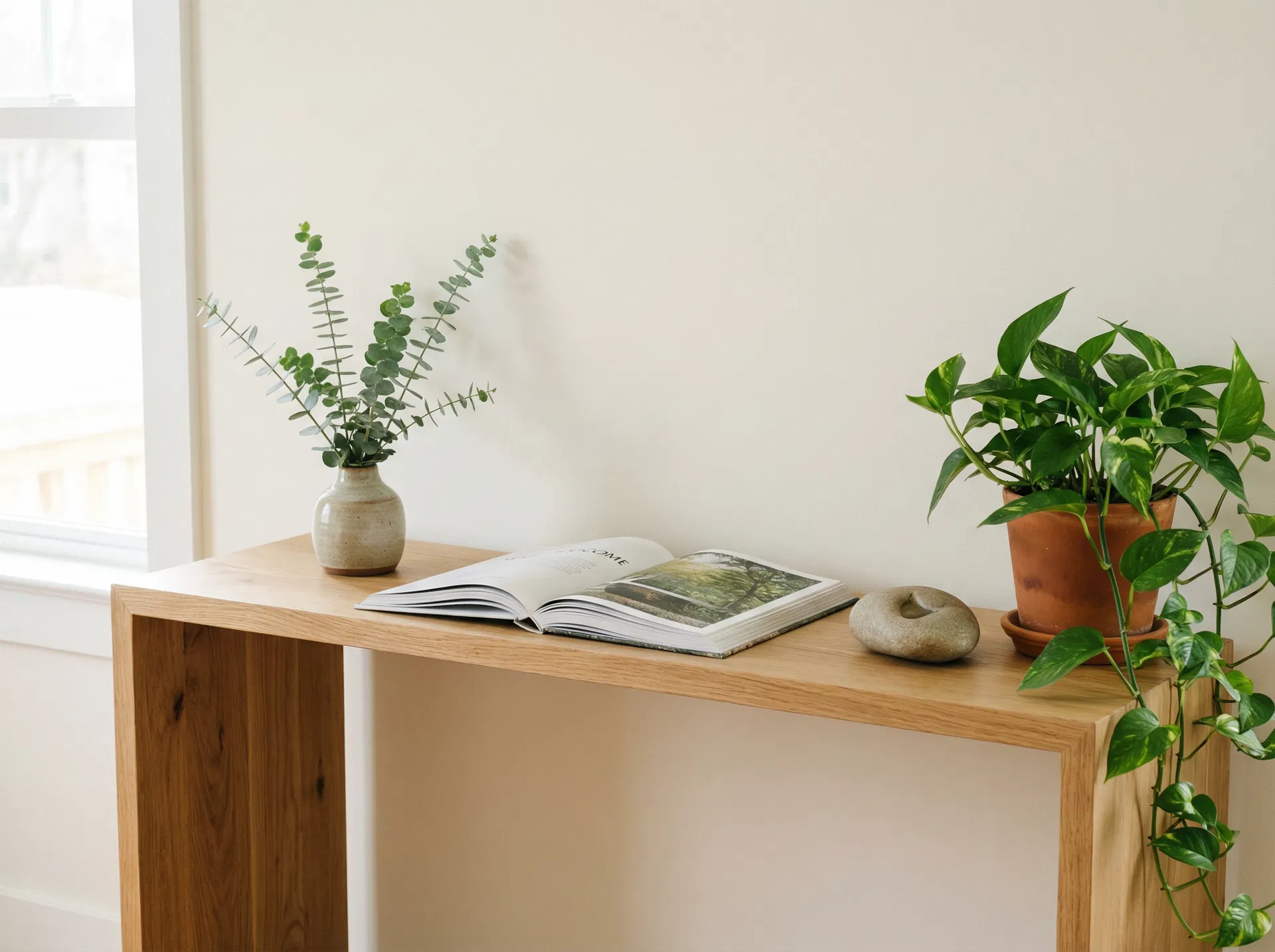 Minimal styled bench with art books and ceramic cup