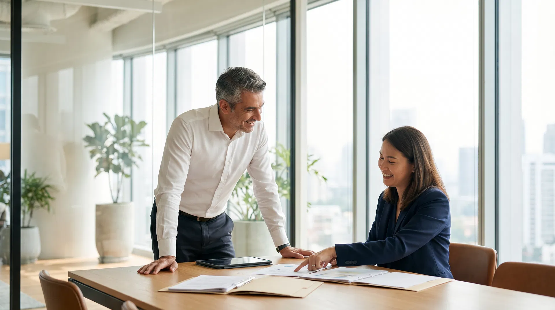 Business owner reviewing PCMP program benefits with Americare consultant