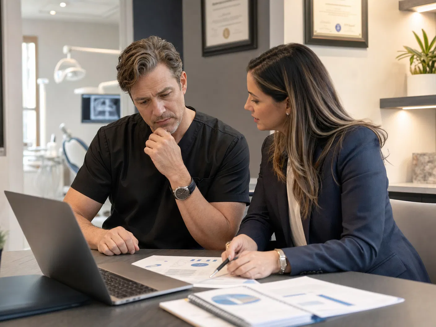 Dental practice owner and strategist reviewing AI visibility signals and patient acquisition reports