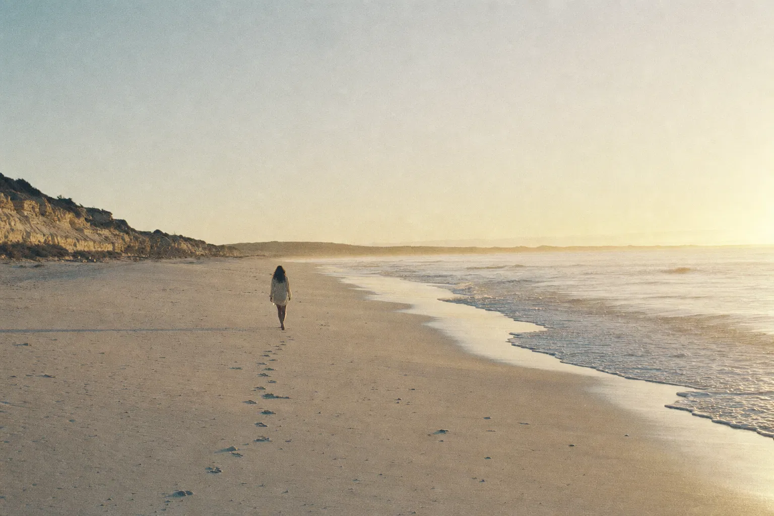 Walking along Peppermint Grove Beach at sunrise